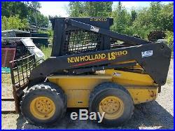 2003 New Holland LS180 Skid Steer with 576 hrs two buckets, forks, augers